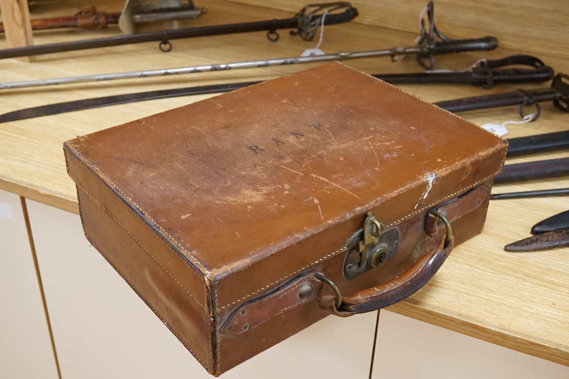 A Harrods brown leather gun/ammunition case, the lid with five leather restraining straps inside, and a good Harrods Ltd. Gun and Rifle Dept. label to the inside of the lid, dimensions; 40cm wide, 29cm high, 12.5cm deep